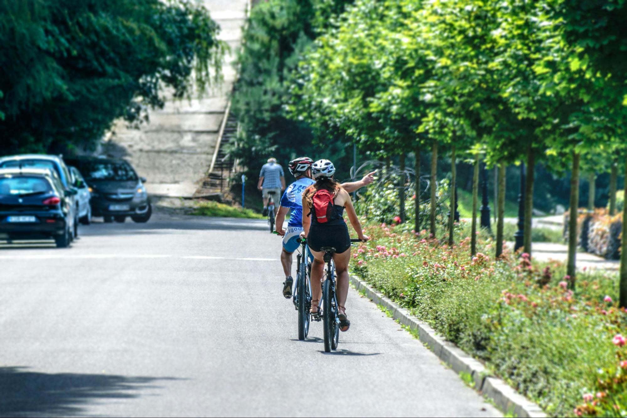 Two people riding a bike