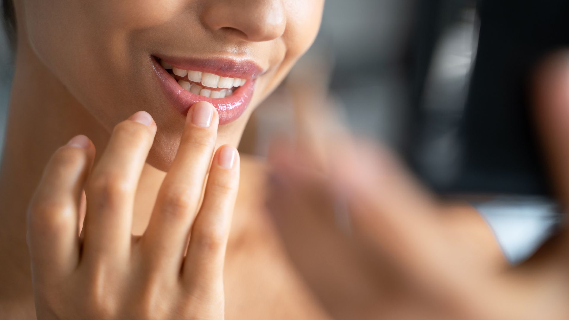 woman applying lip balm